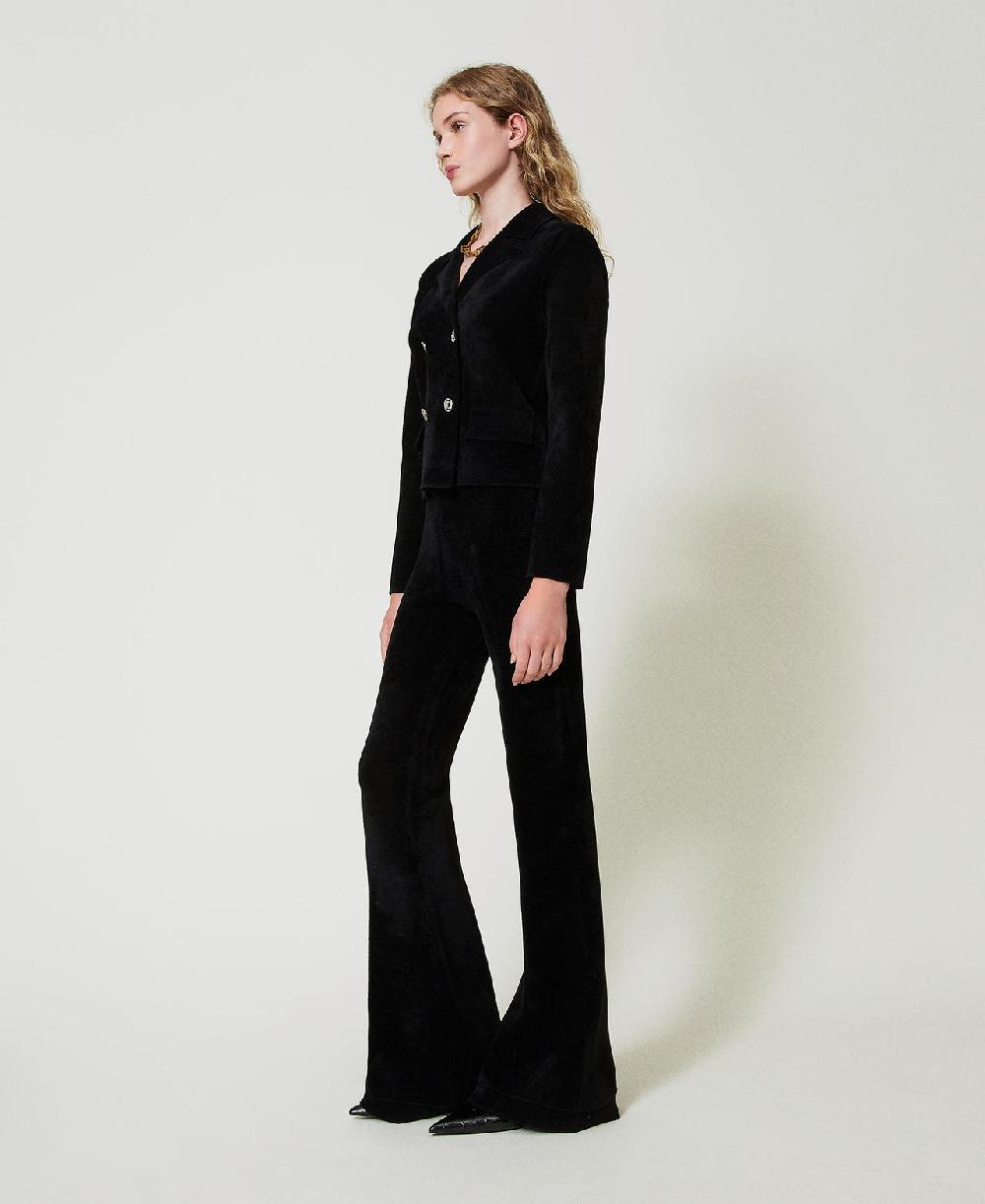 Scee by twin set Pantaloni flare in maglia con bottoni Oval T ACQUISTA ORA