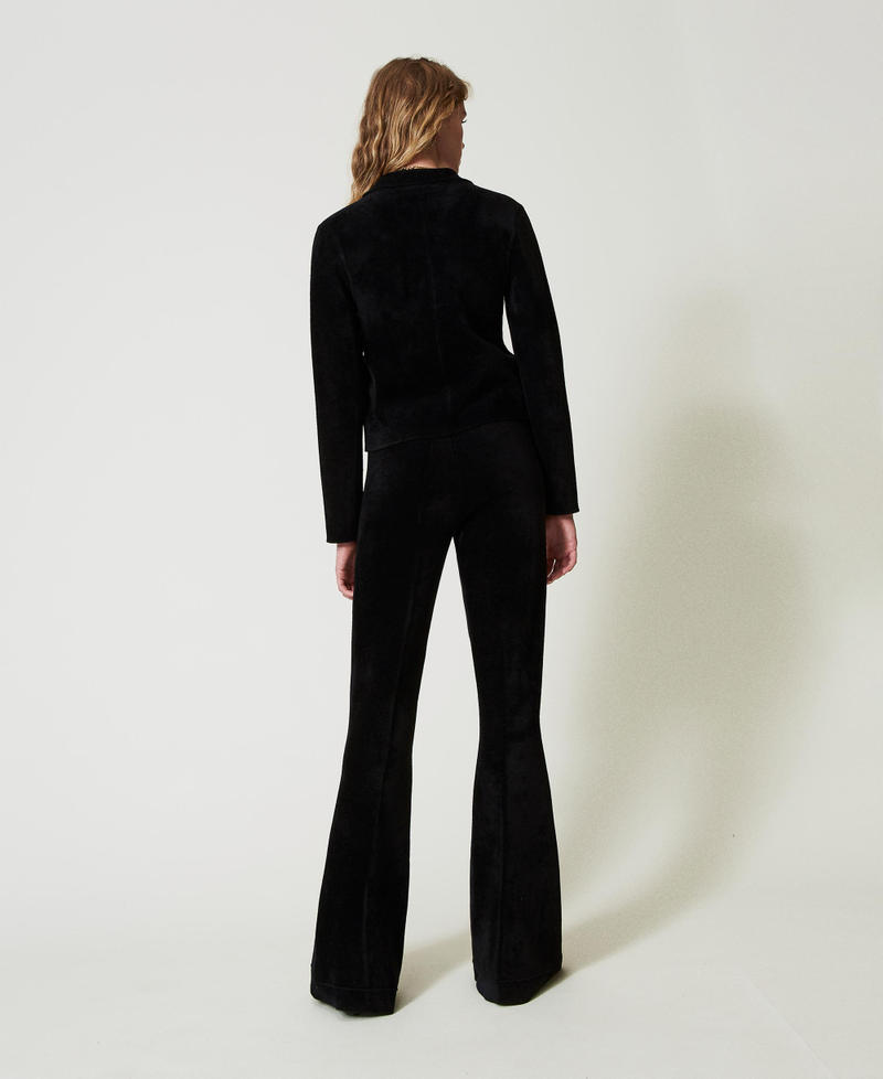 Scee by twin set Pantaloni flare in maglia con bottoni Oval T ACQUISTA ORA