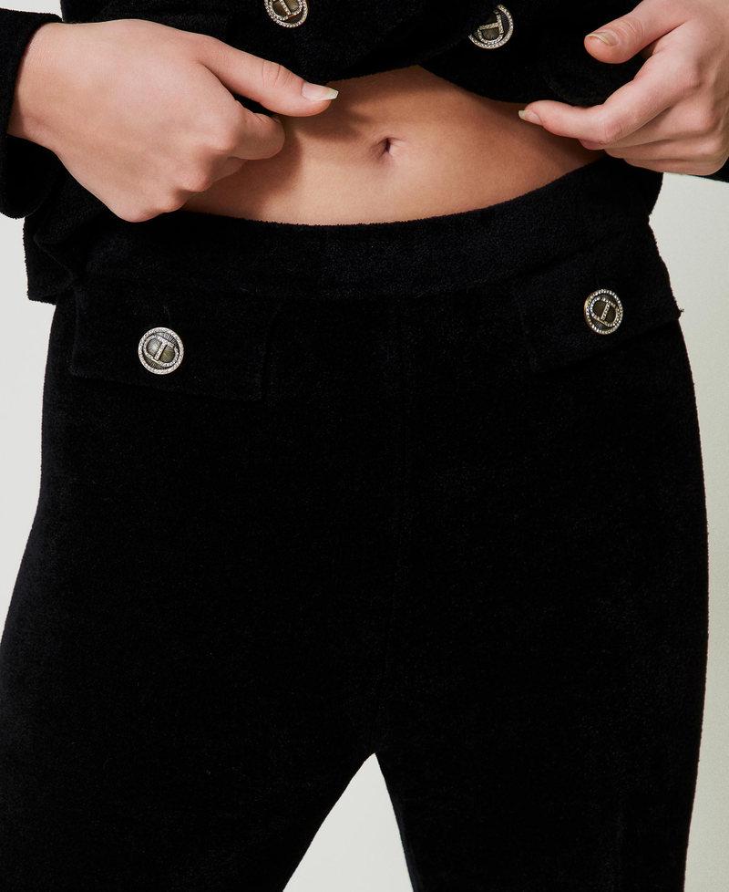 Scee by twin set Pantaloni flare in maglia con bottoni Oval T ACQUISTA ORA